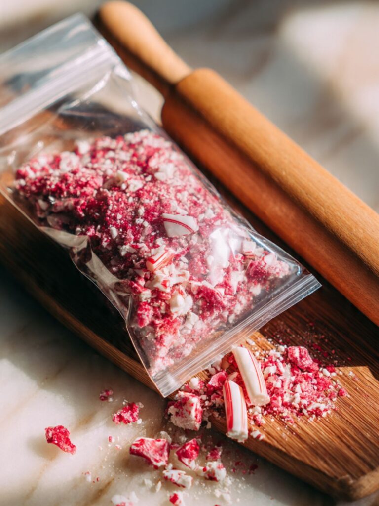 crushed candy cane pieces in a zip-lock bag for chocolate peppermint cookie cups topping