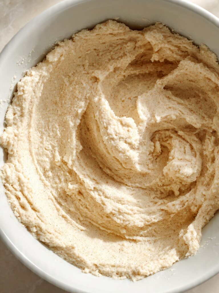 Finished snickerdoodle cookie dough in mixing bowl soft and cohesive ready for portioning