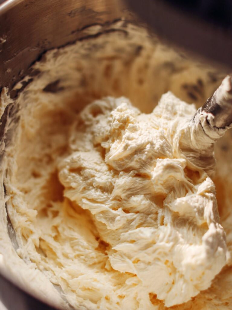 Creamed butter and sugar in stand mixer bowl pale ivory and fluffy for snickerdoodle cookie dough